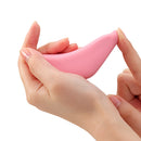 Person holding Tenga Iroha+ Tori Nadeshiko Clitoral Vibrator highlighting its soft silicone and ergonomic design.