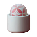 Tenga Iroha Temari Hana Clitoral Vibrator in a sleek white case, showcasing its elegant design and rounded shape.