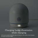 MIZU charging lamp illuminated while charging, showcasing its elegant design and functionality.