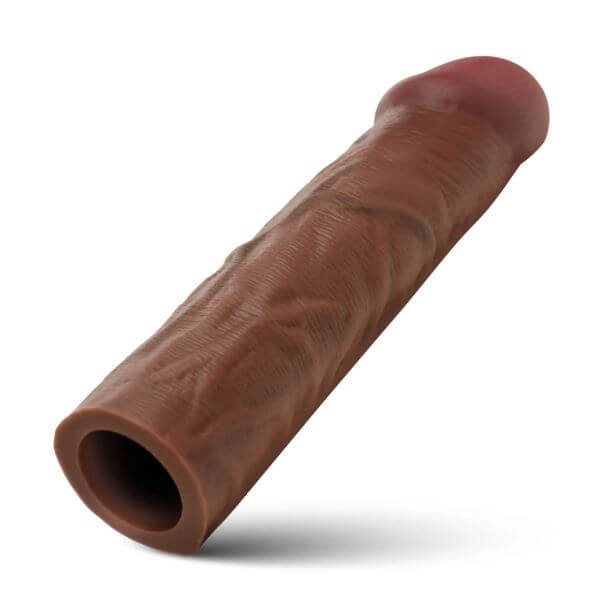 Jock Enhancers Silicone Penis Extension Sleeve 1.5 inches Chocolate shown from an angle, highlighting textured details.