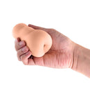 Pocket Pals Stroker Ass Caramel in a hand showcasing its realistic design and soft texture.