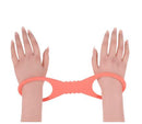 Peaches N Creame Silicone Cuff Large on two hands, showcasing comfort and flexible restraint.