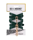 Sex & Mischief Indica Cutout Cuffs in emerald green faux leather with gold hardware for seductive elegance.