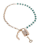 Sex & Mischief Indica Crystal Day Collar featuring green crystal accents and a gold chain with padlock and key.