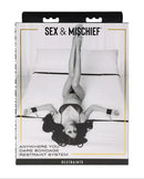 Sex & Mischief Anywhere You Dare Bondage Restraint System packaging featuring a model in a bedroom setting.