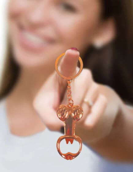 Super Fun Penis Bottle Opener Key Chain held by smiling person, adding humor and functionality to any occasion.