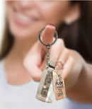 Last Fuck I have to Give Key Chain held by a smiling person, showcasing its fun and bold design.