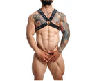 Male Basics Dngeon Classic Cross Harness Black worn by a muscular man showcasing a bold, stylish design.