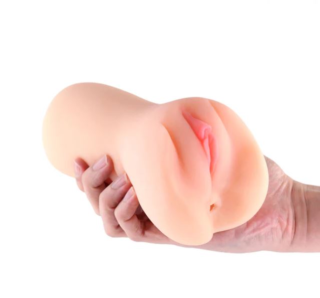 I Dream of MILF Angela Realistic Stroker Pussy Vanilla in hand, showcasing its lifelike design and soft TPE material.