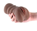 I Dream of MILF Cassandra Realistic Stroker Pussy Chocolate held in hand, showcasing lifelike design and material.