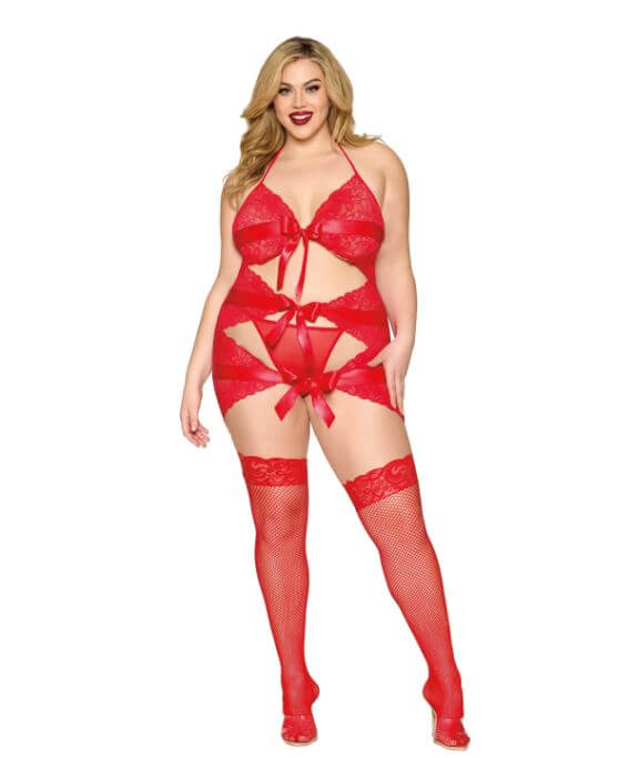 Plus size model in red Garter Slip & G-String Set with scalloped stretch lace, ribbon bow details, and wide satin ribbon, wearing matching stockings.