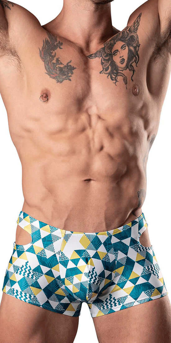 Man wearing geometric patterned blue and yellow cutout shorts.