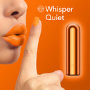 Woman signaling silence next to whisper-quiet Kool Vibes Rechargeable Mini Bullet Vibrator in tangerine color.