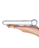 Glass Straight Dildo 7 inches Clear resting in a hand, showcasing its smooth design and handcrafted quality.