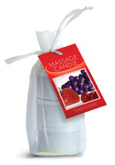 Earthly Body Edible Massage Candle 3 Pack in gift wrap with a tag showcasing strawberries and grapes.