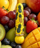 Maia Kona Rechargeable Bullet Vibrator Pineapple Print among fresh fruits, showcasing its playful design.