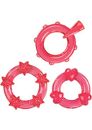 Magic C Rings Cock Rings 3 Piece Set Red includes three textured rings: stars, nubbies, and hearts for added stimulation.