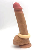 Maia Gunner Vanilla Liquid Silicone C Ring on a realistic silicone dildo model