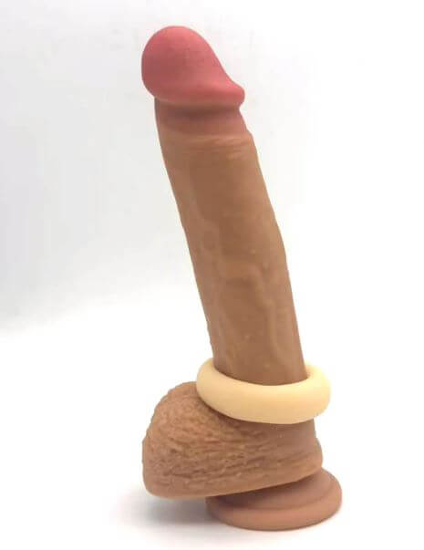 Maia Gunner Vanilla Liquid Silicone C Ring on a realistic silicone dildo model