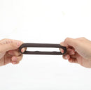 Maia Gunner Liquid Silicone C Ring Chocolate being held, showcasing its stretchy and durable design.