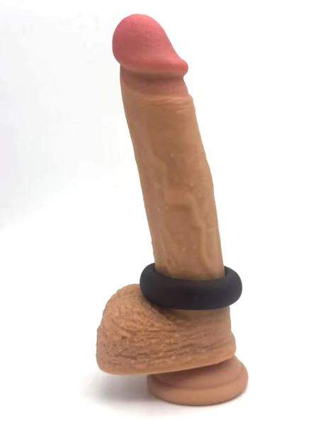 Maia Gunner Liquid Silicone C Ring Chocolate on a lifelike dildo for enhanced performance and comfort.