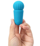 Maia Indi Rechargeable Mini Vibe Blue held in hand, showing compact design and vibrant color.