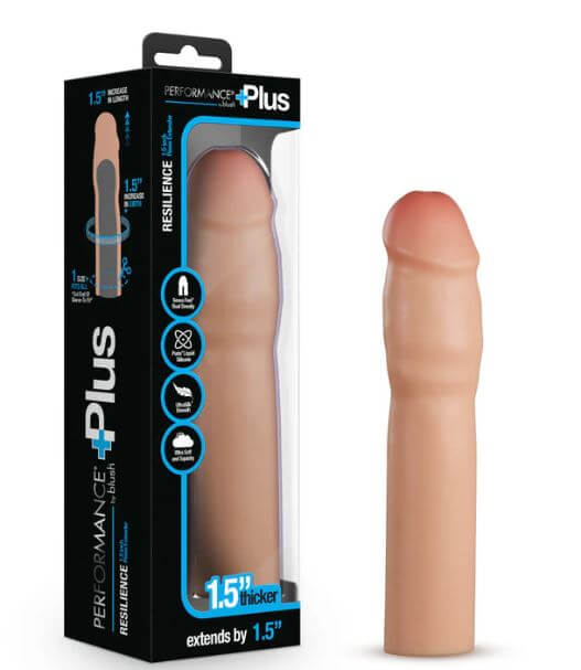 Beige Performance Plus 1.25-Inch Silicone Penis Extender with realistic feel, displayed alongside packaging showing features and size.