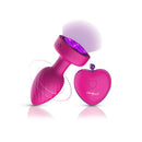 Viben Twila Twirling Light Up Vibrating Anal Plug Pink with glowing jewel base and heart-shaped remote control.