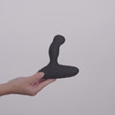 Nexus Revo Intense Prostate Massager held in hand, showcasing its ergonomic design for prostate stimulation.