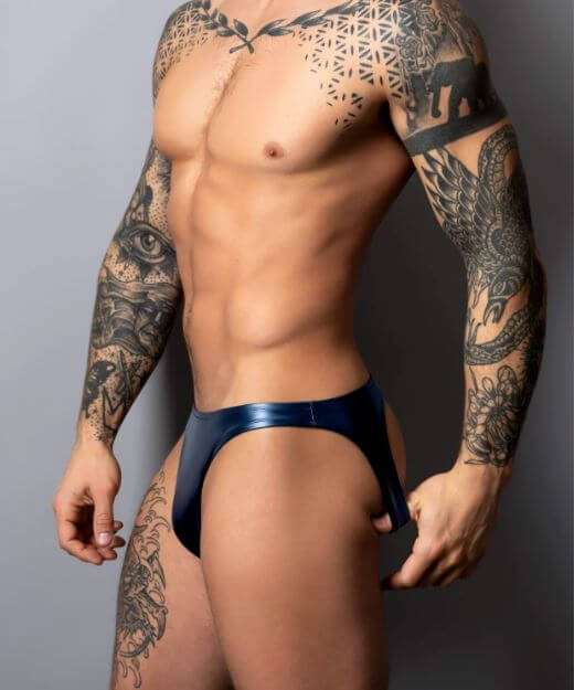 Model showcasing Male Power Liquid Onyx 2.0 Moonshine Blue wet look jock brief design with tattoos.