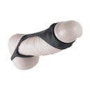 Enhancer Textured Cock Strap and Ball Stretcher Black on a textured surface.