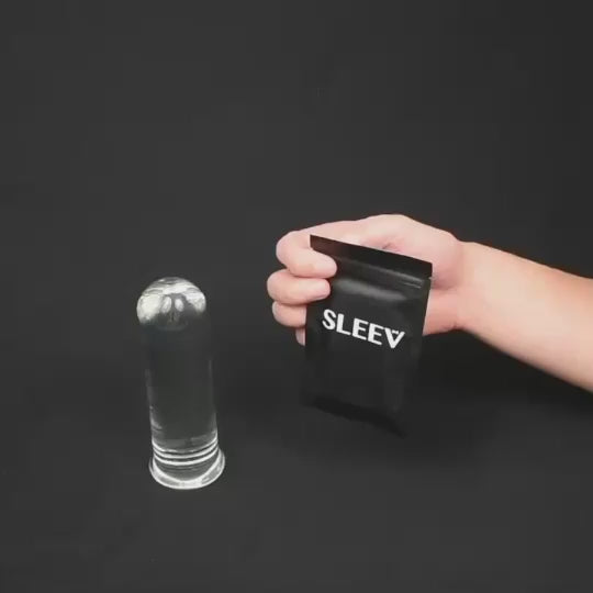 Sleev Individual Pouch Stroker to Go packaging next to a transparent stroker, showcasing convenience and portability.