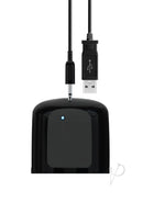 USB charging cable connected to a black device with LED light indicator.