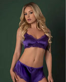 Magic Silk Satin Petals Bralette & Short Set Purple L XL on a model against a green background, showcasing elegant lingerie.