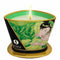 Shunga Erotic Art Green Tea Massage Candle in decorative holder, lit and ready for a sensual experience with natural soy-based oils.