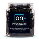 Sensuva On Power Glide Arousal Gel 100 Packet Bowl in a clear display container, showcasing single-use packets.