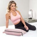 Liberator Jaz Original Sex Pillow Rose with model demonstrating its use in a bedroom setting.