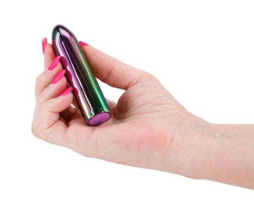 Chroma Petite Bullet Rechargeable Vibrator held in a hand showcasing its sleek design and vibrant colors.