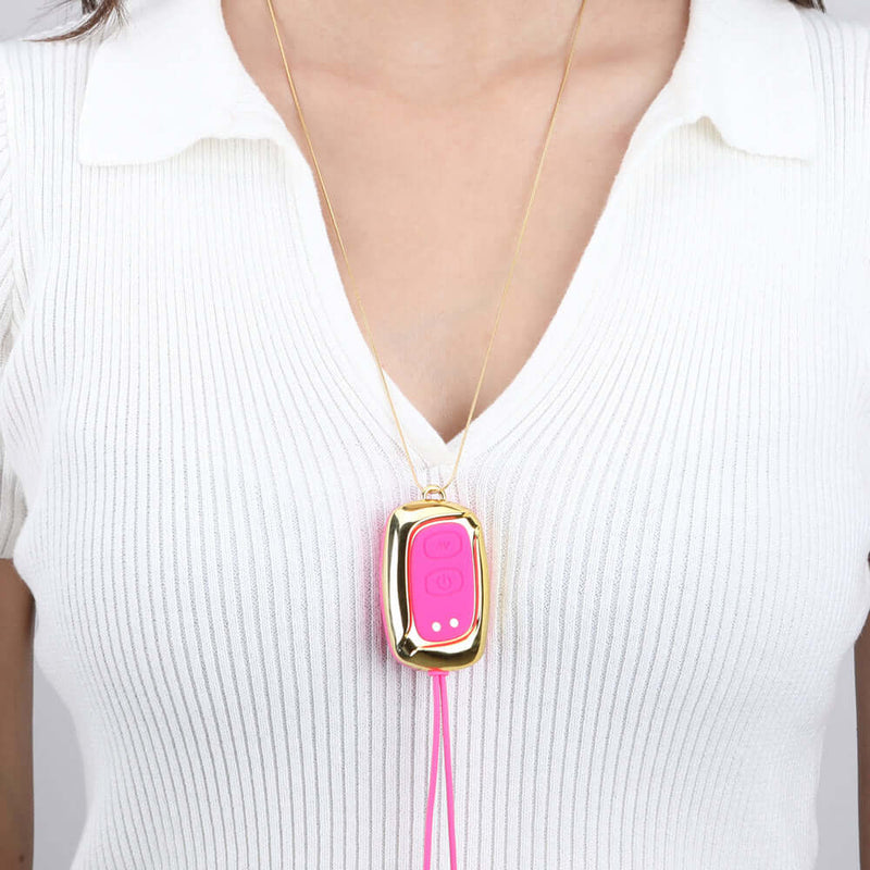 Molli Vibrating Nipple Clamps and Necklace Pink by Maia Toys showcased as a stylish accessory on a model.