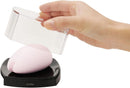 Tenga Iroha Sakura Clitoral Vibrator Pink being unveiled from its elegant packaging.
