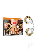 Temptasia Faux Fur Cuffs Leopard shown with packaging featuring a model holding the cuffs.