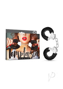Temptasia Faux Fur Cuffs Black packaging with soft black cuffs for playful restraint and role play.