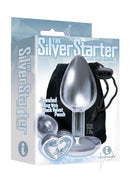 The 9's Silver Starter Bejeweled Heart Butt Plug Diamond packaging featuring a jeweled plug and black velvet pouch.