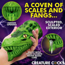 Creature Cocks Dragon Tamer Silicone Stroker Green with fanged opening and scaled exterior design.