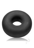 Oxballs Big Ox Super Mega Stretch Silicone Cock Ring Black displayed against a reflective background.