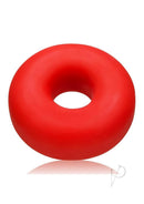 Oxballs Big Ox Super Mega Stretch Silicone Cock Ring Red displayed on a reflective surface.