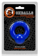Oxballs Gauge Super Flex Cock Ring Blue in packaging, featuring bold color and soft, stretchy design for comfort.