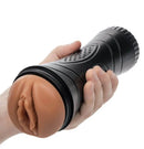 Xcess Tight Pussy Masturbator Pussy Caramel held in hand showing realistic design and travel-friendly case.