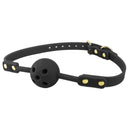 Temptasia Ardor Silicone Ball Gag Black displayed on a black strap with gold accents for comfortable sensory play.