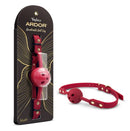 Temptasia Ardor Ball Gag Red displayed in packaging and unboxed, highlighting its breathable design and adjustable fit.